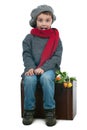 Surprised young boy sitting on a trank Royalty Free Stock Photo