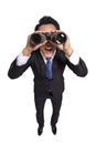 Surprised Young businessman looking through binoculars white background