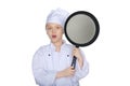 Surprised young chef with a pan Royalty Free Stock Photo