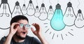 Surprised young guy with glasses, having new idea, looking at light bulb above his head on background of white color. Royalty Free Stock Photo