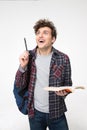 Surprised young man with pen and book Royalty Free Stock Photo