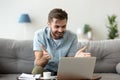 Surprised young man read news on laptop Royalty Free Stock Photo