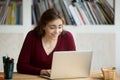 Surprised young woman excited by online win looking at laptop Royalty Free Stock Photo