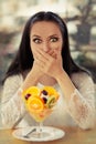 Surprised Young Woman with Fruit Salad Dessert Royalty Free Stock Photo