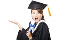 Surprised young woman graduating holding diploma Royalty Free Stock Photo