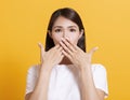 Surprised young woman hand cover mouth