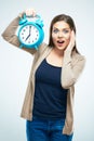 Surprised young woman hold alarm clock. Royalty Free Stock Photo