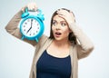 Surprised young woman hold alarm clock. Royalty Free Stock Photo