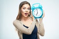 Surprised young woman hold alarm clock. Royalty Free Stock Photo