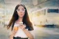 Surprised Young Woman Holding Smartphone and Coffee Cup Royalty Free Stock Photo