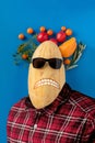 surreal art concept of a human body with a fruit head and face, isolated against the colorful wall