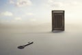 Surreal atmosphere of a key to open a closed door; concept of success, problem solving and freedom