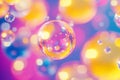 A surreal, colorful abstract background featuring floating liquid spheres. The glossy,