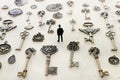 Surreal concept image of person looking at many vintage keys and clocks Royalty Free Stock Photo