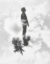 Surreal double exposure of silhouette with trees and clouds