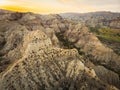 Surreal dramatic deserted earth landscape panorama with beautiful cliff formations and golden sunset background in Vashlovani Royalty Free Stock Photo