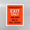 Surreal Emergency Exit Sign with Garbled Text Royalty Free Stock Photo