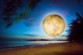 Surreal full moon rise over seaside