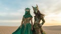 Surreal Green-clad Women In Desert With Ritualistic Masks