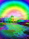 Surreal, Highly Saturated Image of a Construction Site with Buildings and Landscape, Overlaid with a Rainbow Gradient Effect. Royalty Free Stock Photo