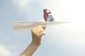 a little boy who flies free over a paper airplane