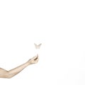 Surreal image of an origami butterfly leaning on a girl`s hand