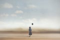 Surreal image of a young woman dreaming with a balloon