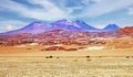Surreal life hostile desert landscape, dry barren sand plain, colorful red orange color hills, volcanic mountains - Salar de