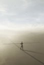 Surreal man balances a very long rod along an imaginary line Royalty Free Stock Photo