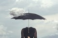 Surreal moment of a cloud caressing the umbrella of a headless woman Royalty Free Stock Photo