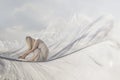 Surreal moment of a lonely woman carried in the sky by a feather Royalty Free Stock Photo