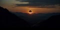 Surreal solar eclipse at sunset over mountains. Mystical eclipse illustration over a desert mountain range. Royalty Free Stock Photo