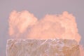 Surreal stone podium table top in outdoor on blue sky gold pink pastel soft cloud background.Beauty cosmetic product placement Royalty Free Stock Photo