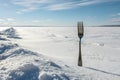 Solitary Fork in a Snowfield: A Reflection on Choices and Isolation Royalty Free Stock Photo