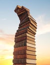 Surreal Tower of Books Reaching for the Sunset Sky Royalty Free Stock Photo