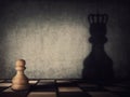 Surreal transformation of the pawn chess piece into a powerful king or queen. Motivation and self confidence metaphor, overcoming Royalty Free Stock Photo