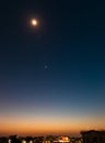 Surreal Twilight Colors. Long exposure of Lightburst Venus Planet with stars in the background and orange sky from setting sun. Royalty Free Stock Photo