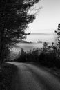 Surreal and uncommon view of St.Francis church in Assisi town Umbria over a sea of fog, at the end of a road in the Royalty Free Stock Photo