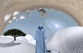 Surreal white desert with figure in cloak