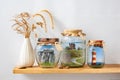 Surrealistic landscapes of England, Scotland in glass jars