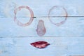 Surrealistic lips funny facial image on wooden blue background