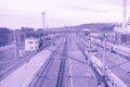 Surrealistic violet toned perspective image of the large railway