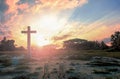 Surrender concept: Silhouette of crucifix cross on mountain at sunset time with holy and light background Royalty Free Stock Photo