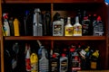 Surrey, BC / Canada - 02/24/2020: Authentic mechanic`s auto shop shelf of motor oil used for oil changes in car repair and mainten