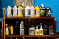 Surrey, BC / Canada - 02/24/2020: Authentic mechanic`s auto shop shelf of motor oil used for oil changes in car repair and mainten