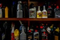 Surrey, BC / Canada - 02/24/2020: Authentic mechanic`s auto shop shelf of motor oil used for oil changes in car repair and mainten Royalty Free Stock Photo