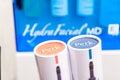 Surrey, BC / Canada - 06/11/19: HydraFacial Perk lip and eye treatment products, showing the facial machine in the background, at