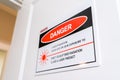 Surrey, BC, Canada - 06/11/2019: Laser radiation danger sign on door of laser clinic for patient safety when using cosmetic laser