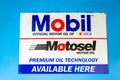 Surrey, BC / Canada - 02/24/2020: Mobil, Nascar and Motosel motor oil logos on a sign in a mechanic`s shop