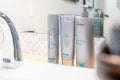 Surrey, BC / Canada - 07/16/19: SkinMedica Facial Cleanser, Sensitive Skin Cleanser and Rejuvenate Toner on bathroom sink. High en